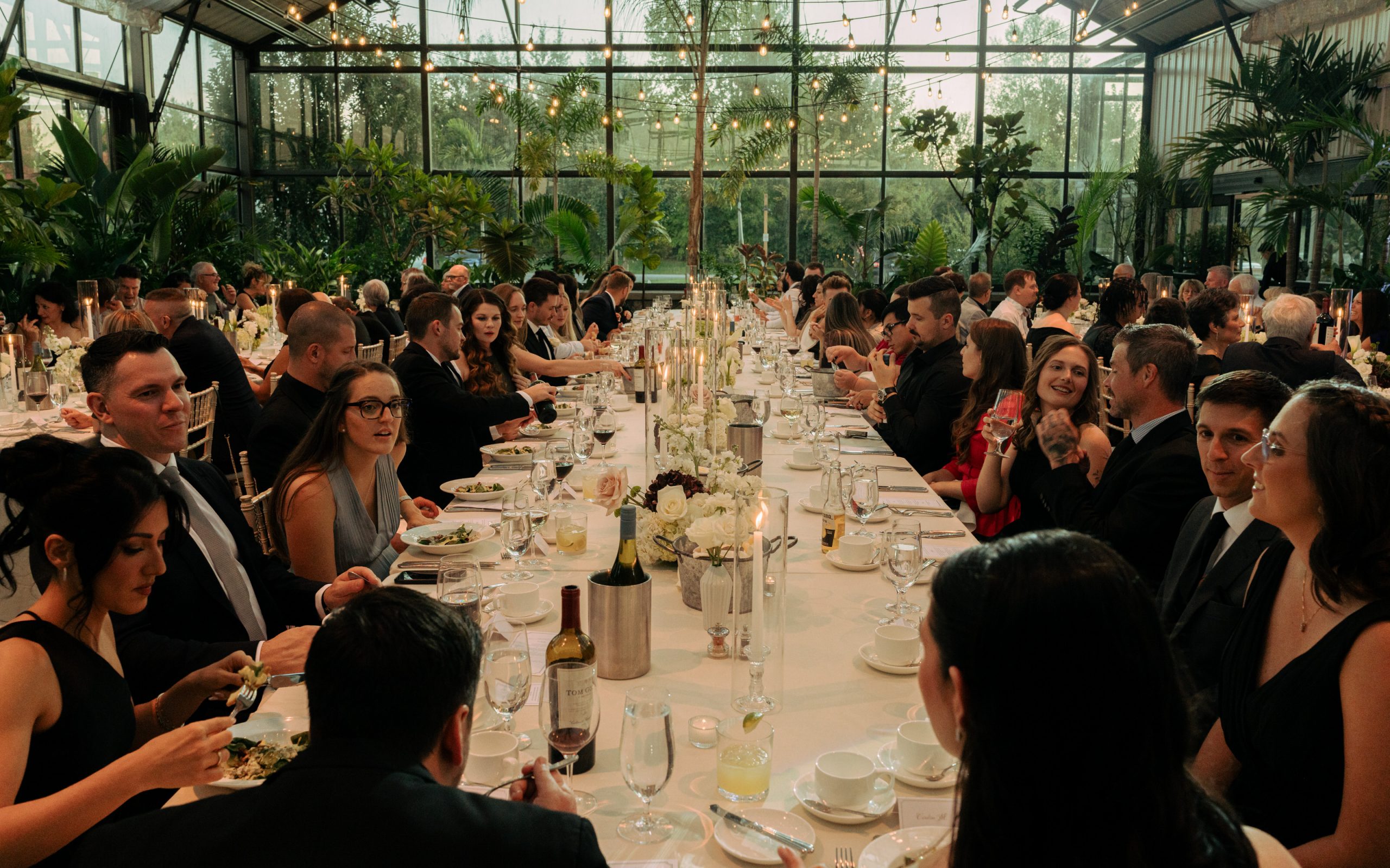 Long head table at large aquatopia wedding