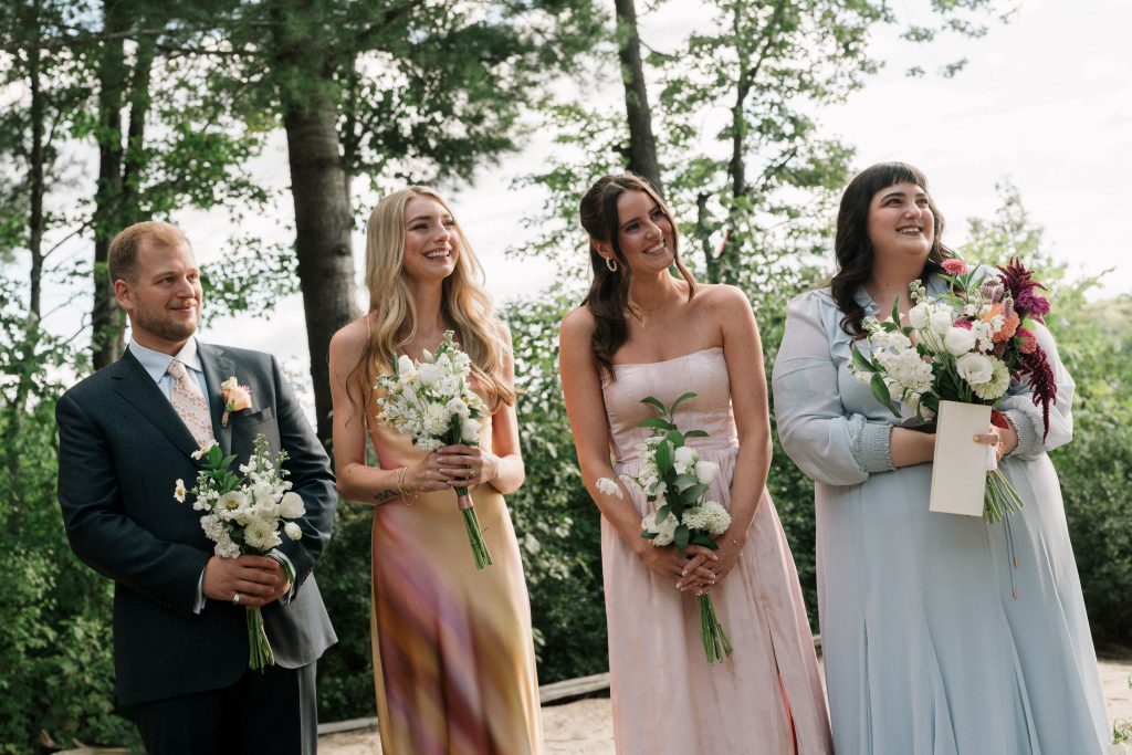 bridesmaids happy for bride